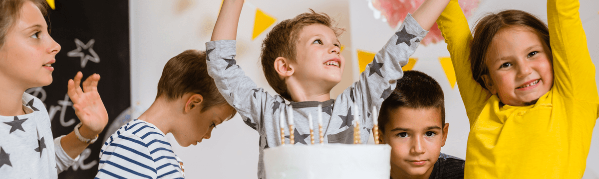 Children with birthday cake at 4 Mammies for kids