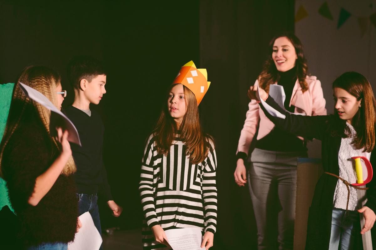 Teens rehearsing on a stage for their next play at Close Encounters Theater in Zurich