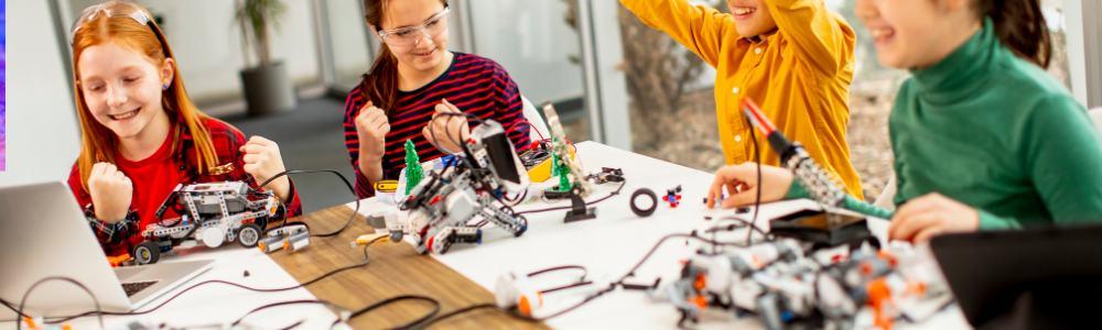 A group of teens building robots together at Codora after-school classes in Zurich, Switzerland