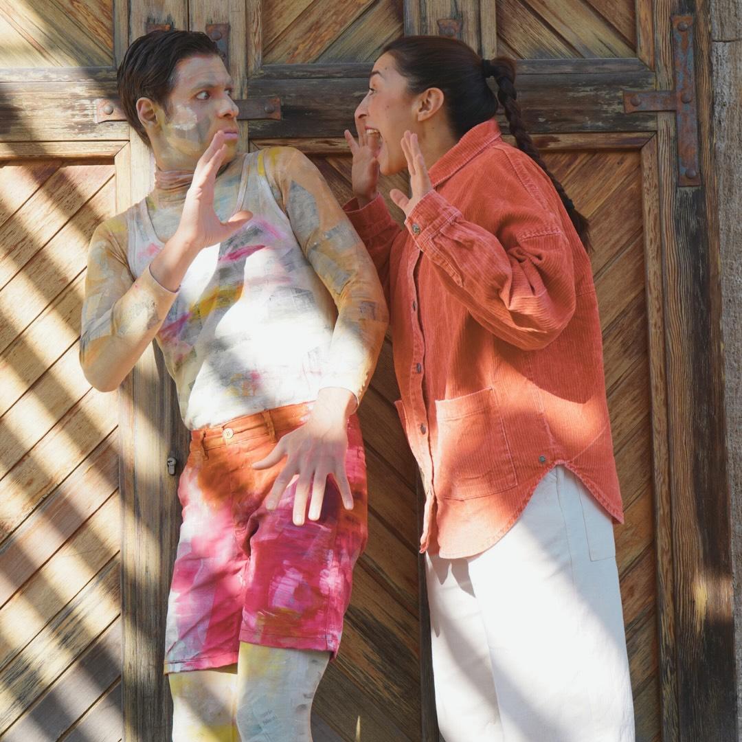 A young man and woman performers in colorful clothes performing photograph during an interactive children's performance In Motion at the National Glyptotheque in Goudi, Athens, Greece.