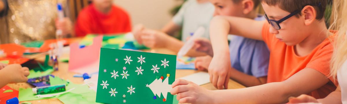 Children are creating Christmas cards during their afternoons at the activity center Don Quixote in Vironas in Athens, Greece.  There they learn to cook, craft, build sing and play in teams by expert professionals.  