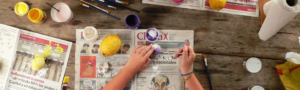 Children ages 1 to 4 years old creating art work with paint and natural materials at the bilingual Spanish and English playgroup Imagination studio near Zurich, Switzerland.