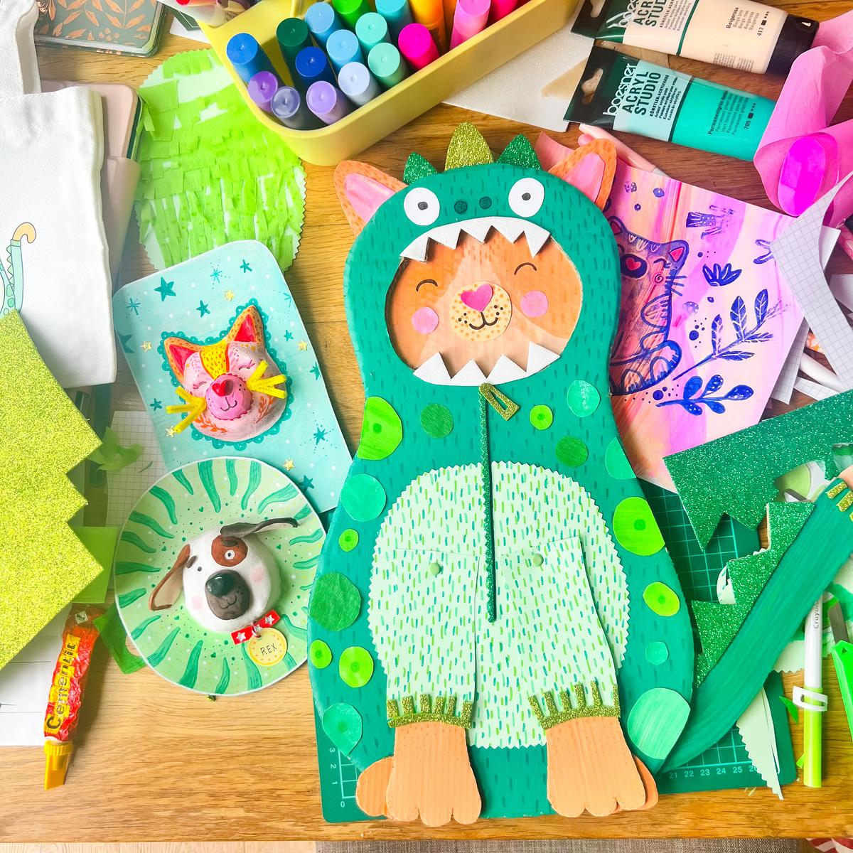 Colorful paper crafts with emphasis on greens and purple dinosaurs and shapes at Loubilou creative craft camps in Switzerland.  