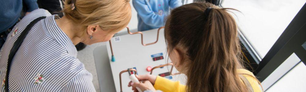 A middle school class is experimenting safely with electricity on a network board they created at the Science Museum in Agios Dimitrios in Athens, Greece.