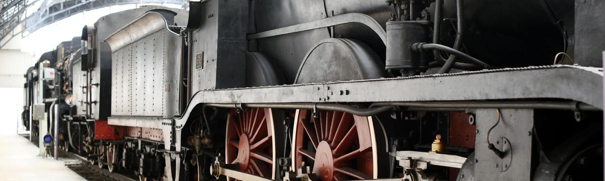 The over 100-year-old steam locomotive 'Schnaaggi-Schaaggi' of the Zürcher Museums-Bahn pulling vintage passenger cars through the scenic Sihltal between Zürich Wiedikon and Sihlwald.