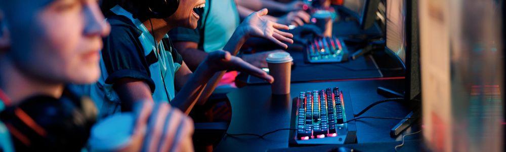 Teenage boys and girls playing video games all together at the gaming section of the Gameorama Interactive Museum in Luzern