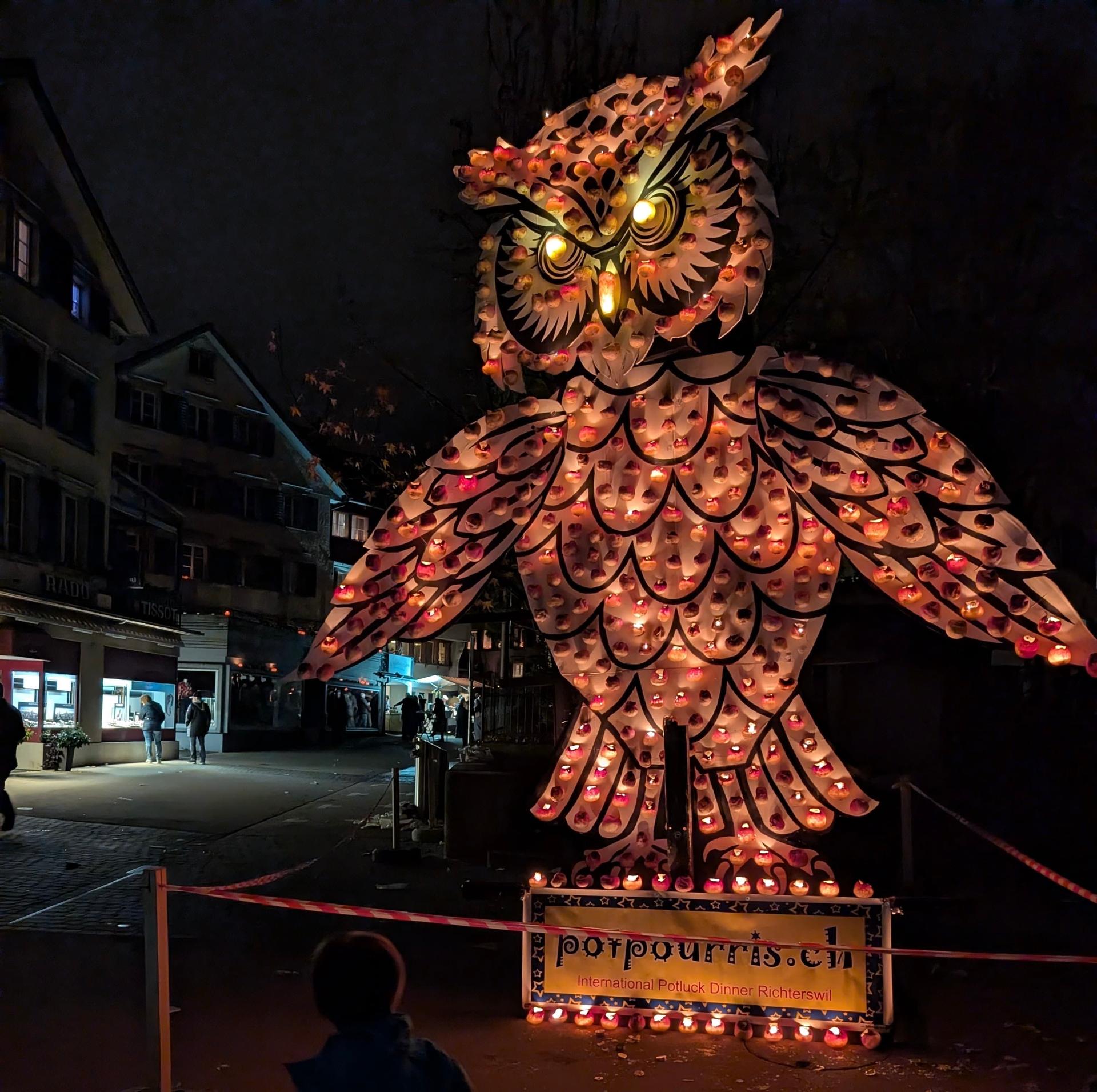 A giant owl statue at the Raebeliechtli parade in Richterswil, Switzerland in November 2024. A turnip festival where turnips are carved into lanterns and used to build intricate structures that parade the streets of Richterswil, in Canton Zurich.