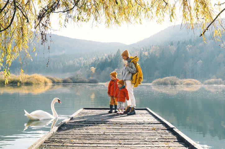 lake nature mom and son on deck